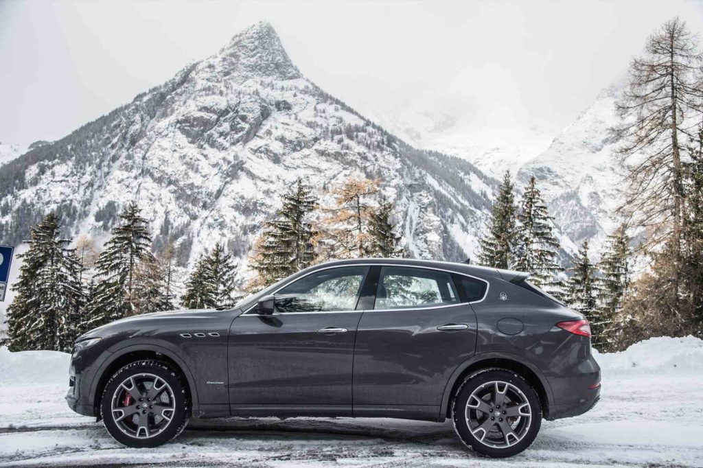 The Maserati Levante GranLusso pictured with a snowy mountain in Courmayeur Italy
