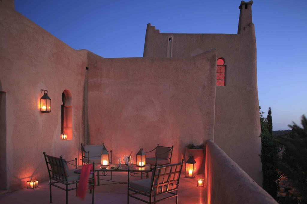 A tranquil balcony at night at the Jardin Des Douars in Morocco