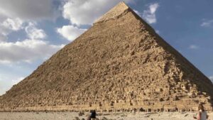 Giza Pyramids in Egypt with woman standing in front